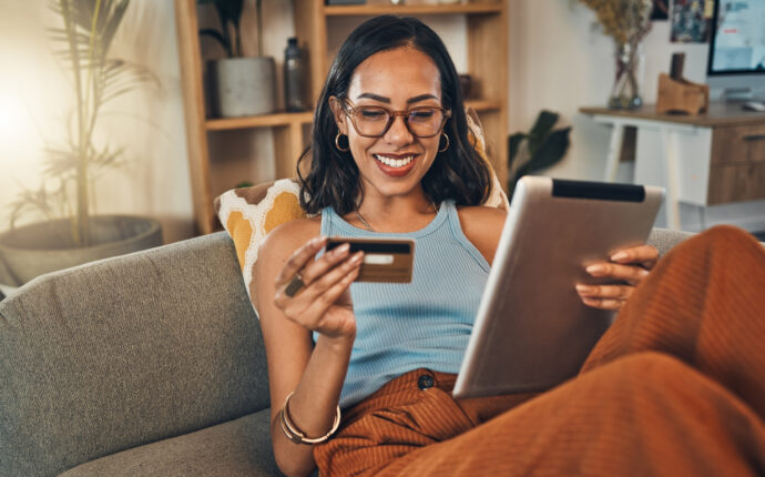 Woman looking at credit card